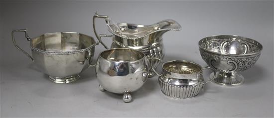 A Victorian silver sugar bowl, Edward Hutton, London, 1883, three other sugar bowls and a cream jug.